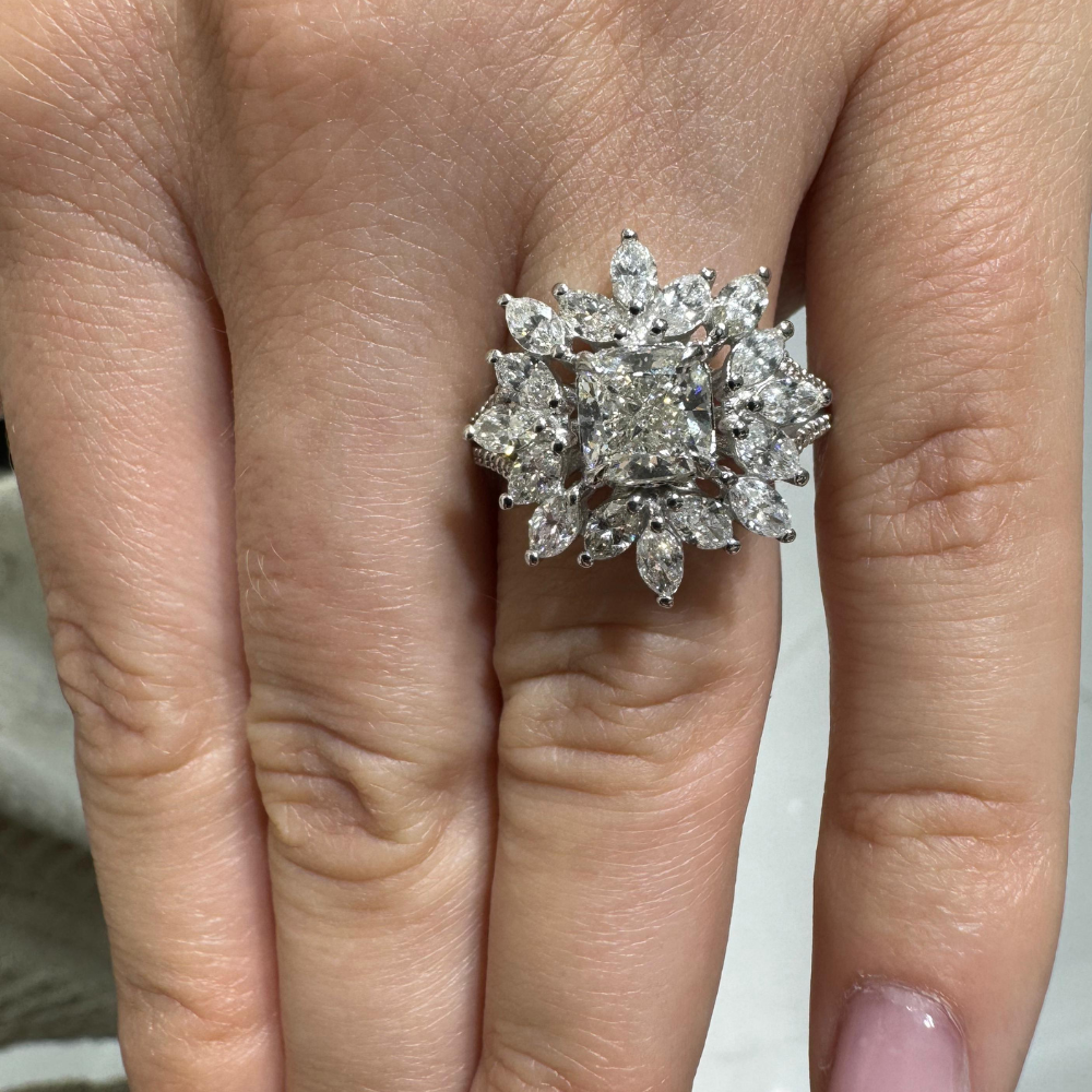 Ring with 1.50 ct center diamond, 1.69 ct Marquise diamonds and 0.18 ct side diamonds
