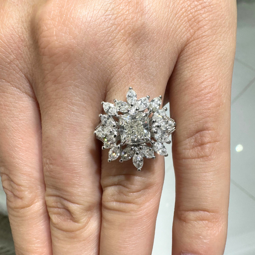 Ring with 1.70 ct center diamond, 1.56 ct Marquise diamonds and 0.18 ct side diamonds