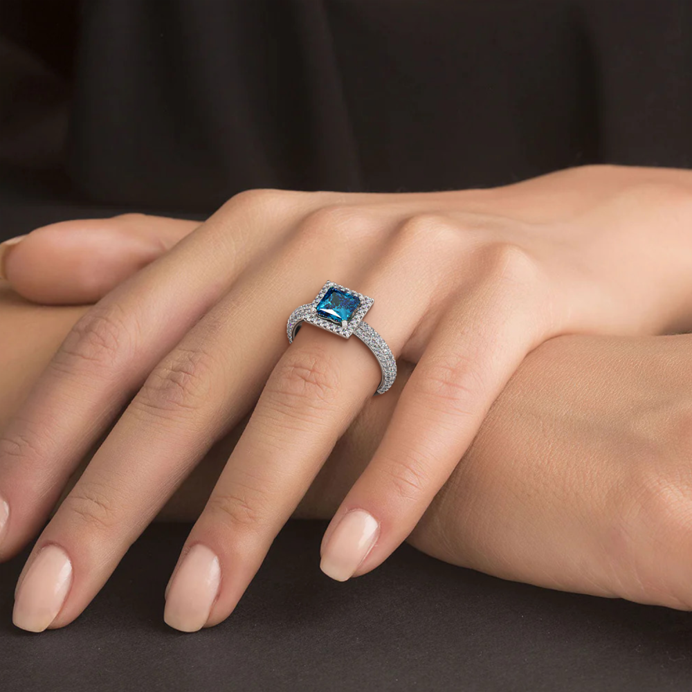 Ring with 0.74 ct Diamonds and 1.00 ct Blue-Topaz