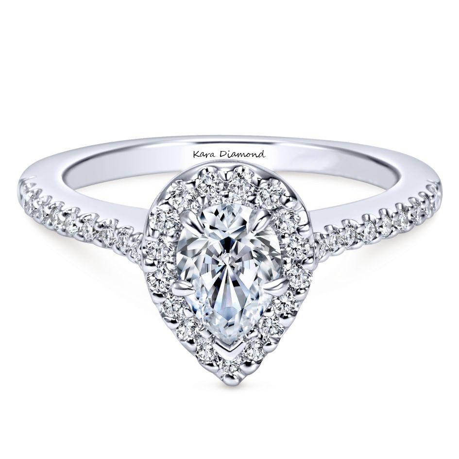 Engagement ring with 0.70 ct Pear diamond and 0.40 ct side diamonds