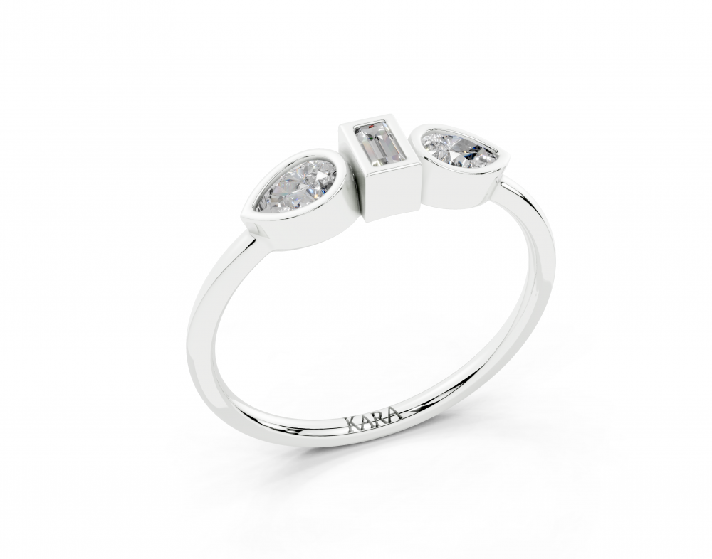 Ring with 0.30ct Pear Cut diamonds and a 0.06ct Baget diamond