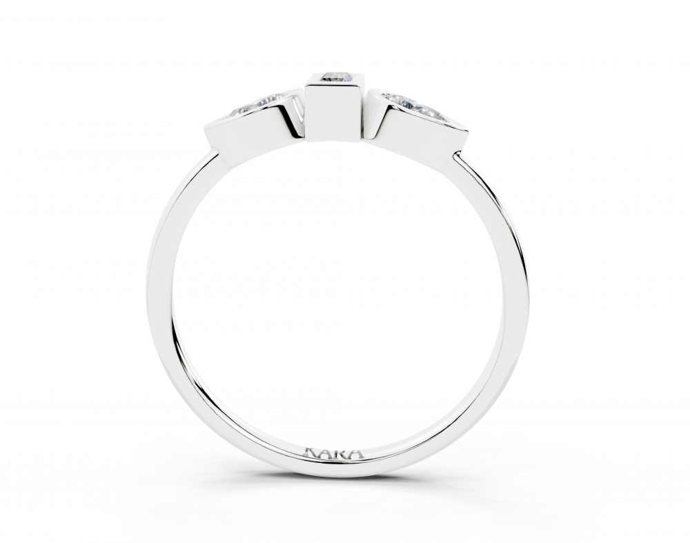 Ring with 0.30ct Pear Cut diamonds and a 0.06ct Baget diamond