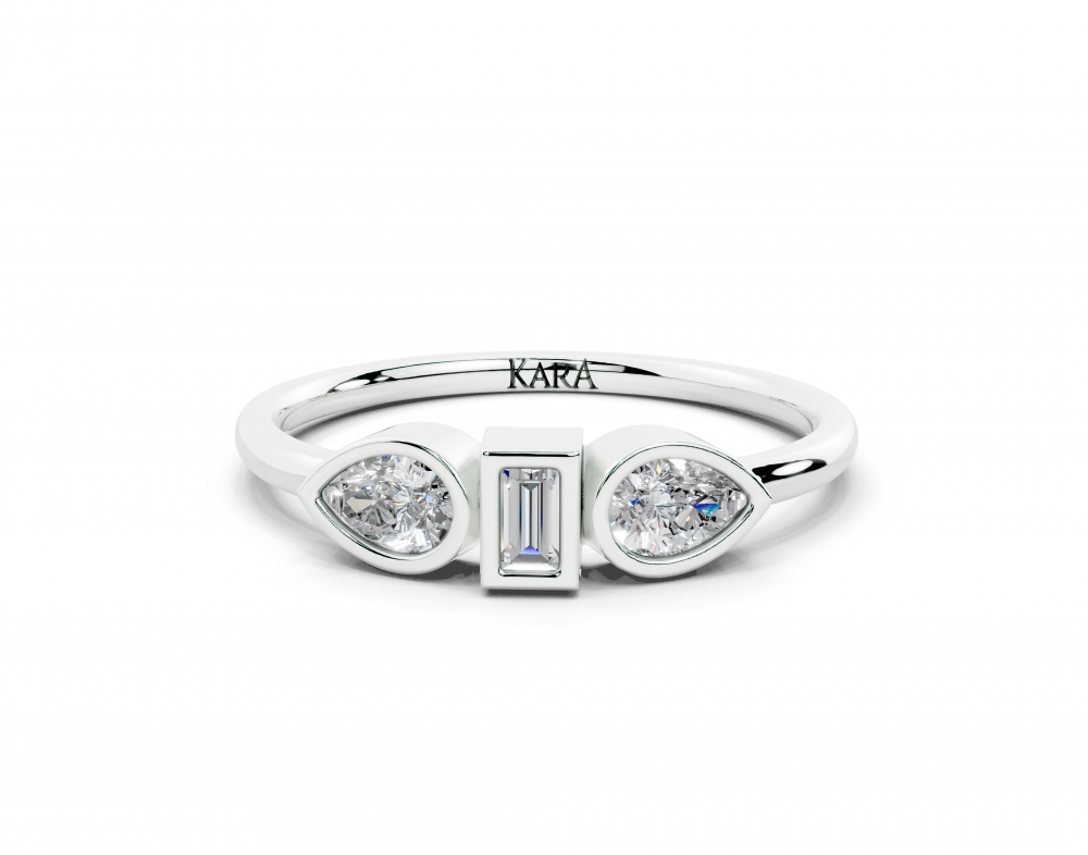 Ring with 0.30ct Pear Cut diamonds and a 0.06ct Baget diamond
