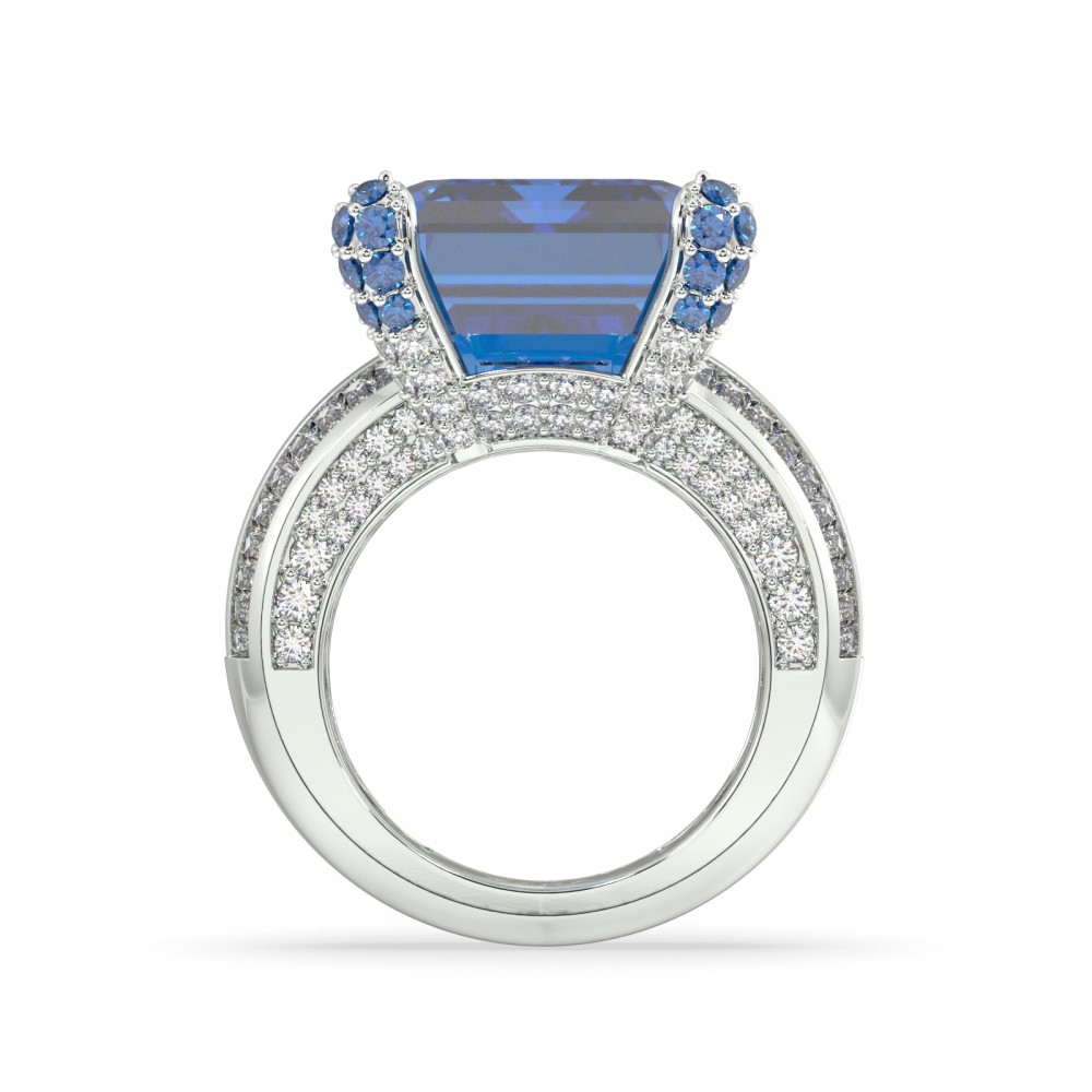 Ring with 1.00 ct Round Diamonds, 0.94 ct Baget Diamonds, 0.10 ct London Blue Topaz, 0.26 ct Emeralds and 20.5 ct London blue Topaz