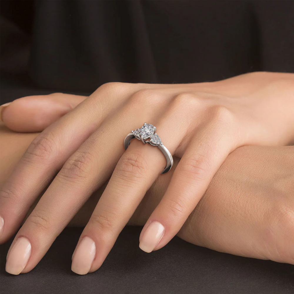 Engagement ring with 0.65 ct Pear center diamond and 0.08 ct side diamonds