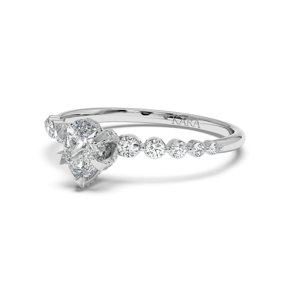 Engagement ring with 0.30 ct Pear diamond and 0.28 ct side diamonds