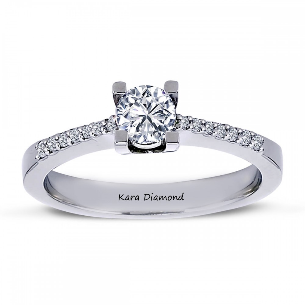 Engagement ring with 0.60 ct center diamond and 0.30 ct side diamonds