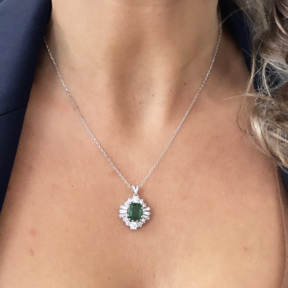 Set with 6.63 ct Emeralds, 2.42 ct Round Diamonds and 1.06 ct Baget Diamonds