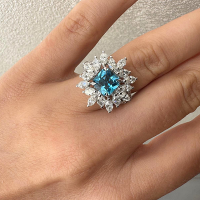 Ring with 0.18 ct Round Diamonds, 1.56 ct Marquise Diamonds and 1.67 ct Blue Swiss Topaz