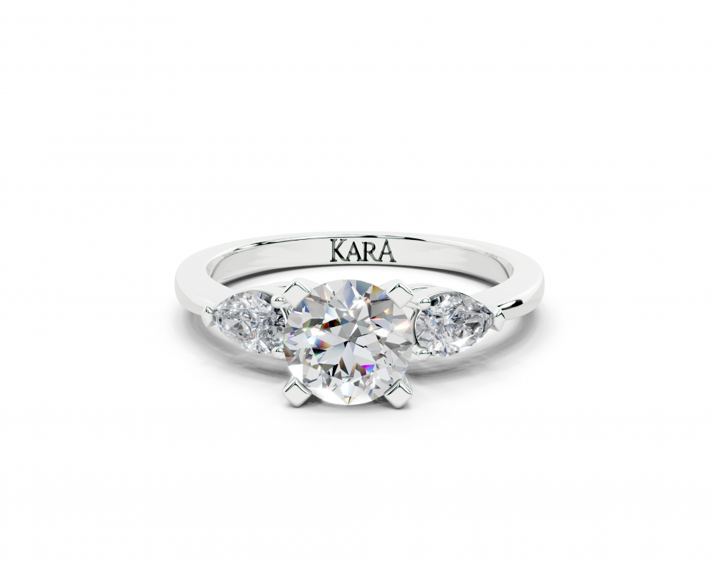 Inel de logodna cu diamant central rotund de 0.73ct si diamante laterale Pear Cut de 0.28ct